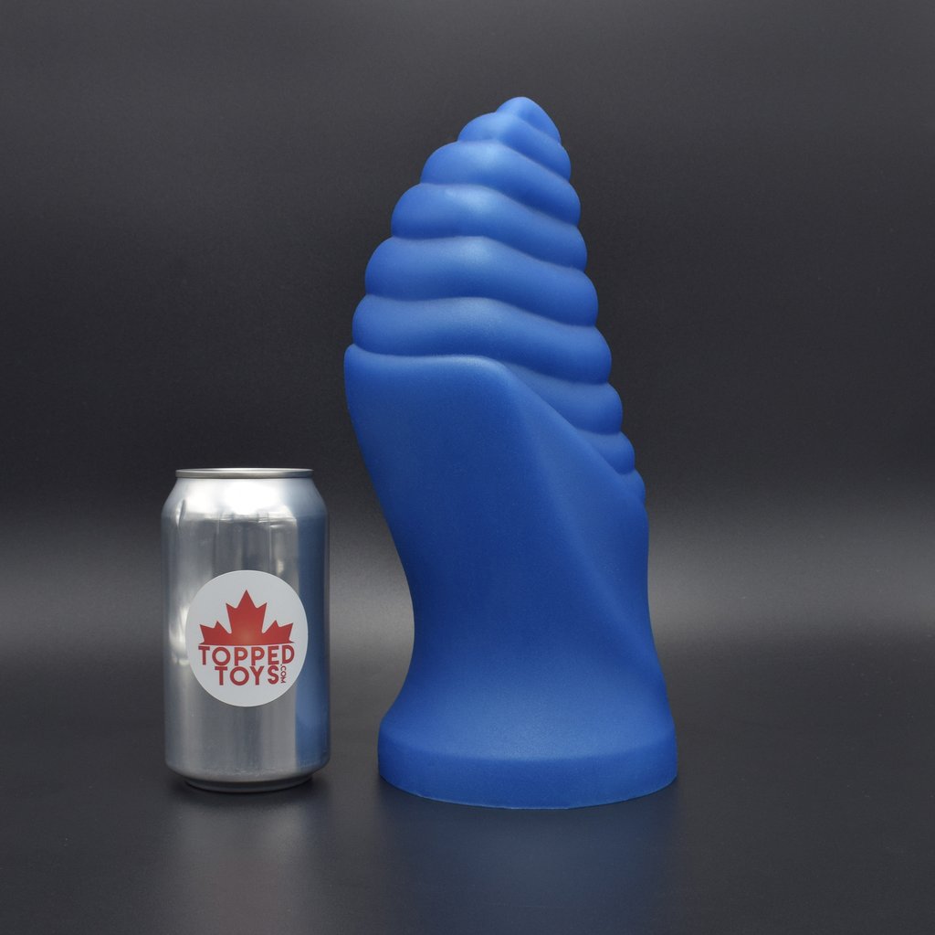 Cetos 130 in Blue Steel facing right, next to pop can with Topped Toys Logo