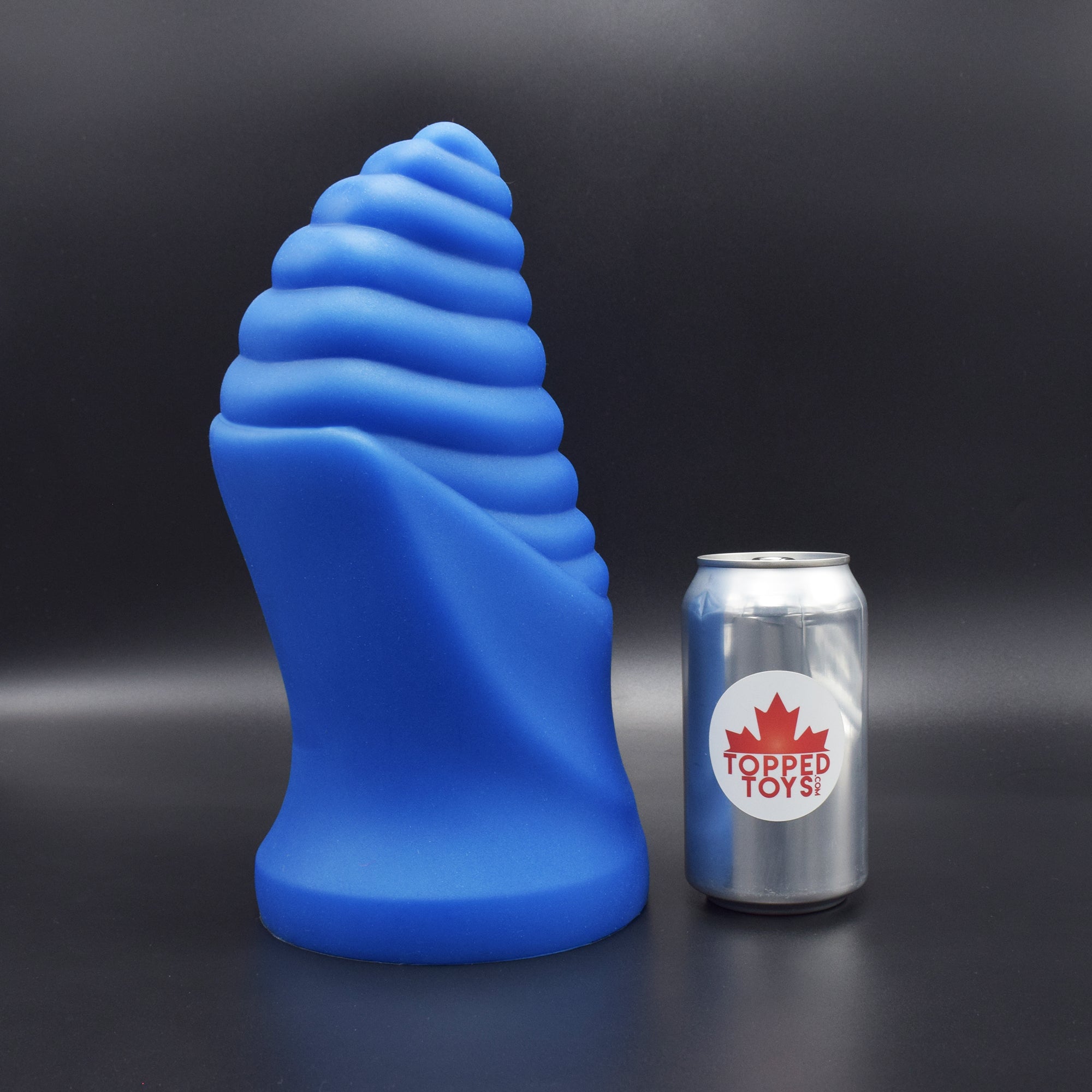 Cetos 150 in Blue Steel facing right, next to pop can with Topped Toys logo
