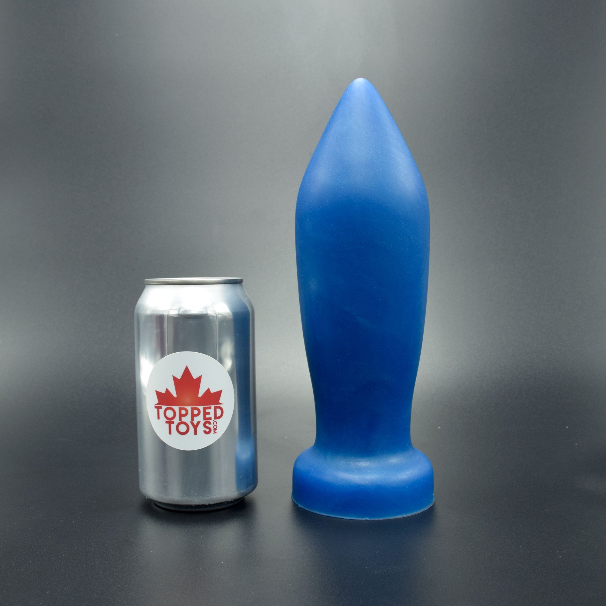 Deep Space 90 in Blue Steel, next to pop can with Topped Toys logo