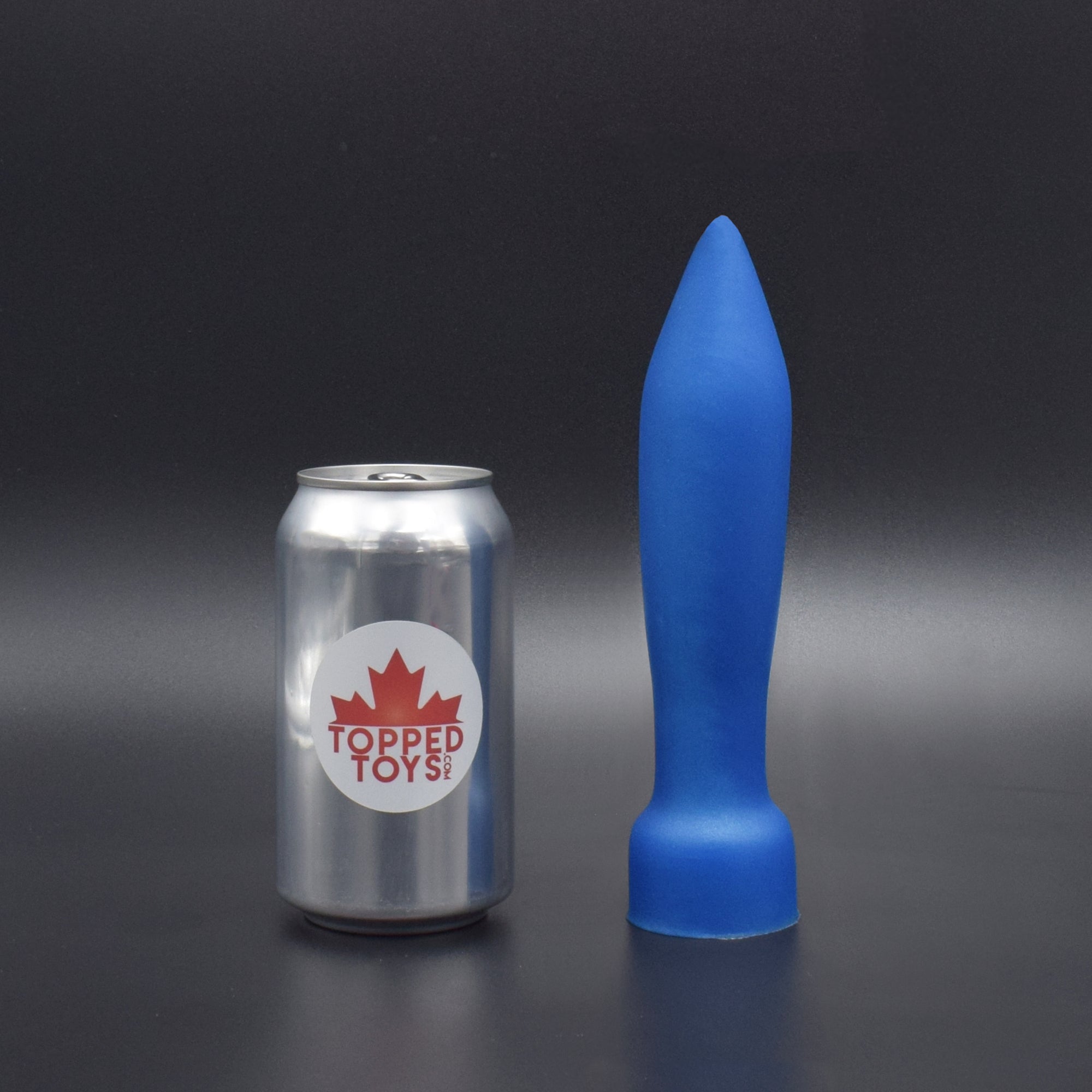Deep Space 50 in Blue Steel, next to pop can with Topped Toys logo