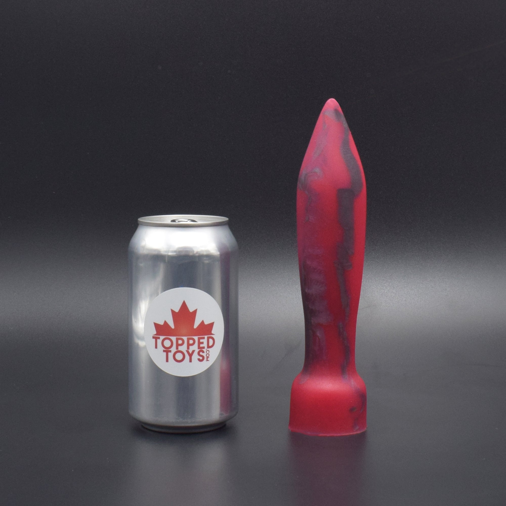 Deep Space 50 in Forge Red, next to pop can with Topped Toys logo