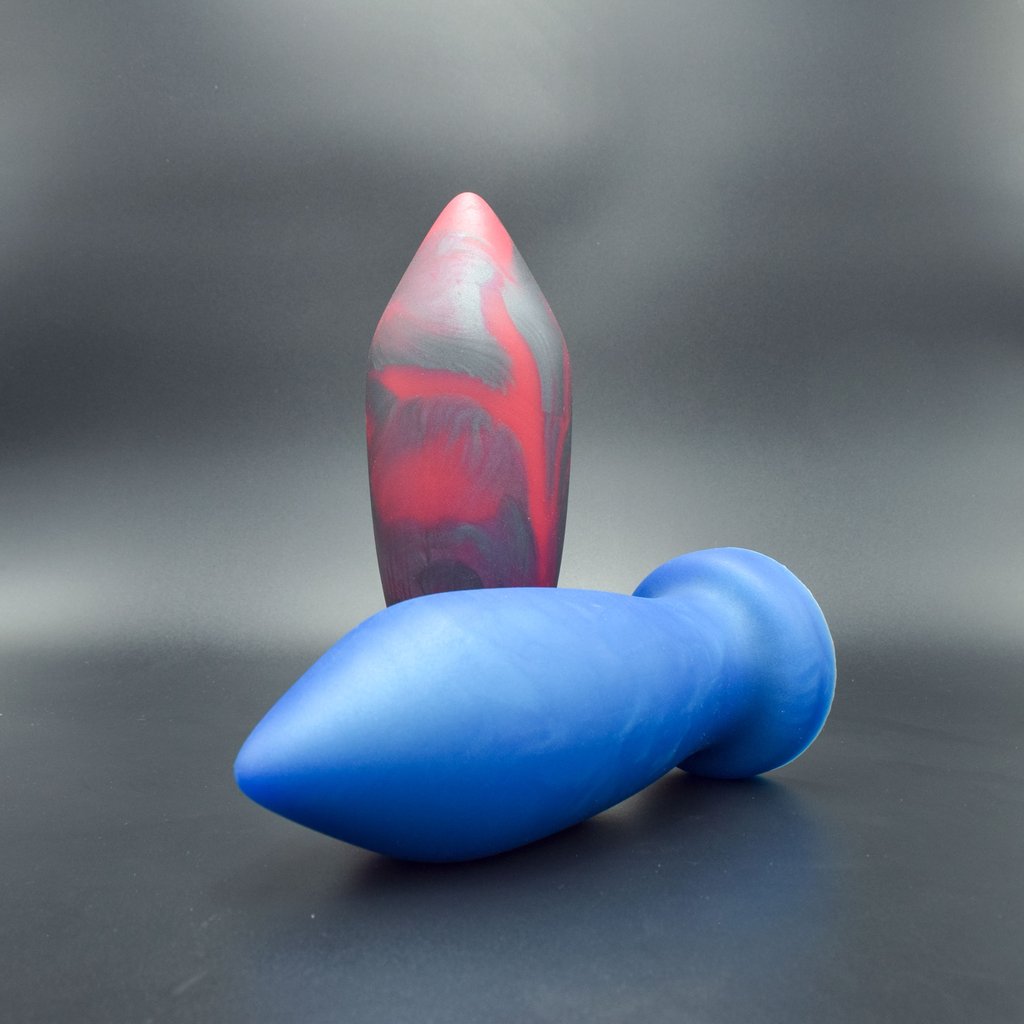 Deep Space 110 in Blue Steel laying on its site, and Deep Space 110 in Forge Red standing up