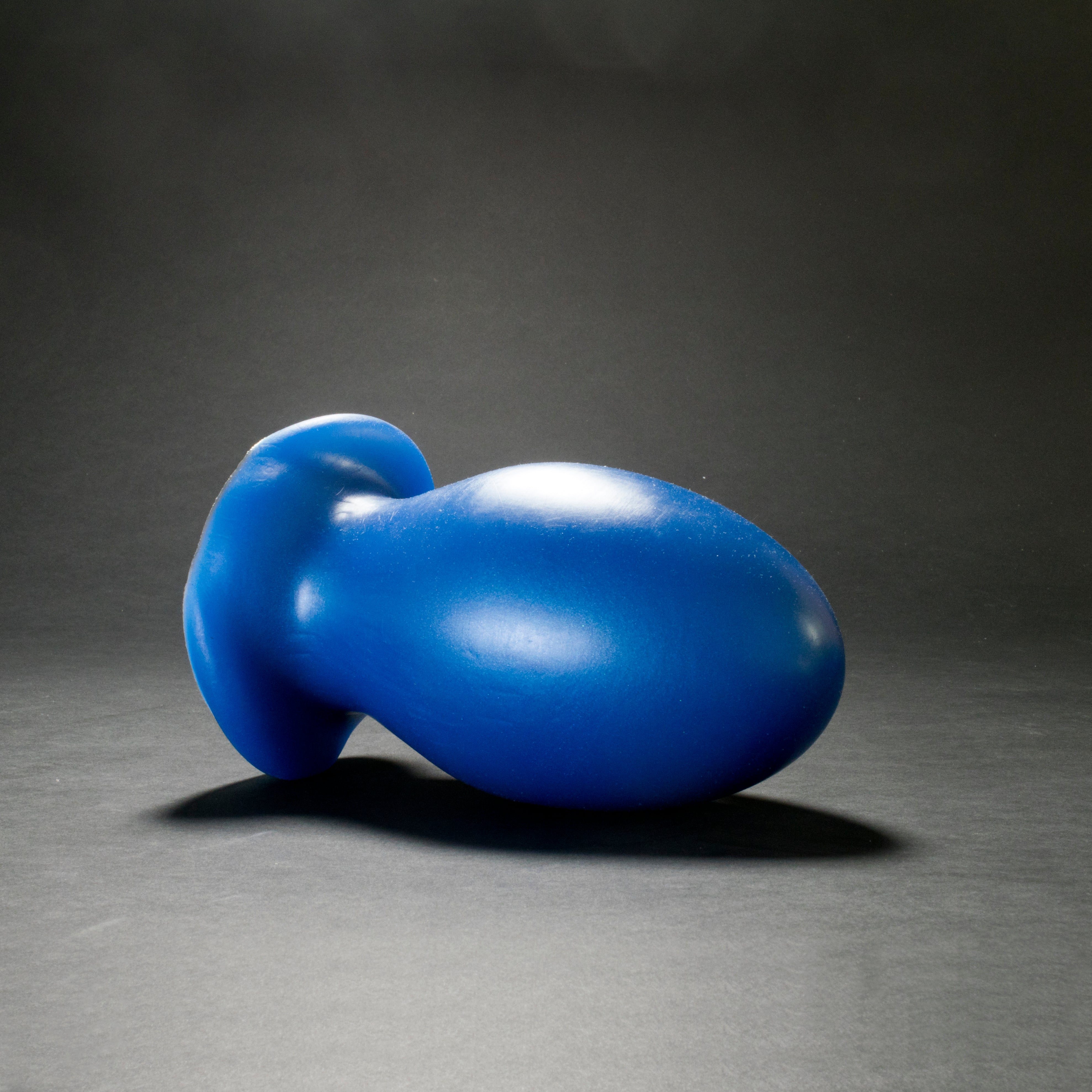 Gape Keeper 128 in Blue Steel laying on its side