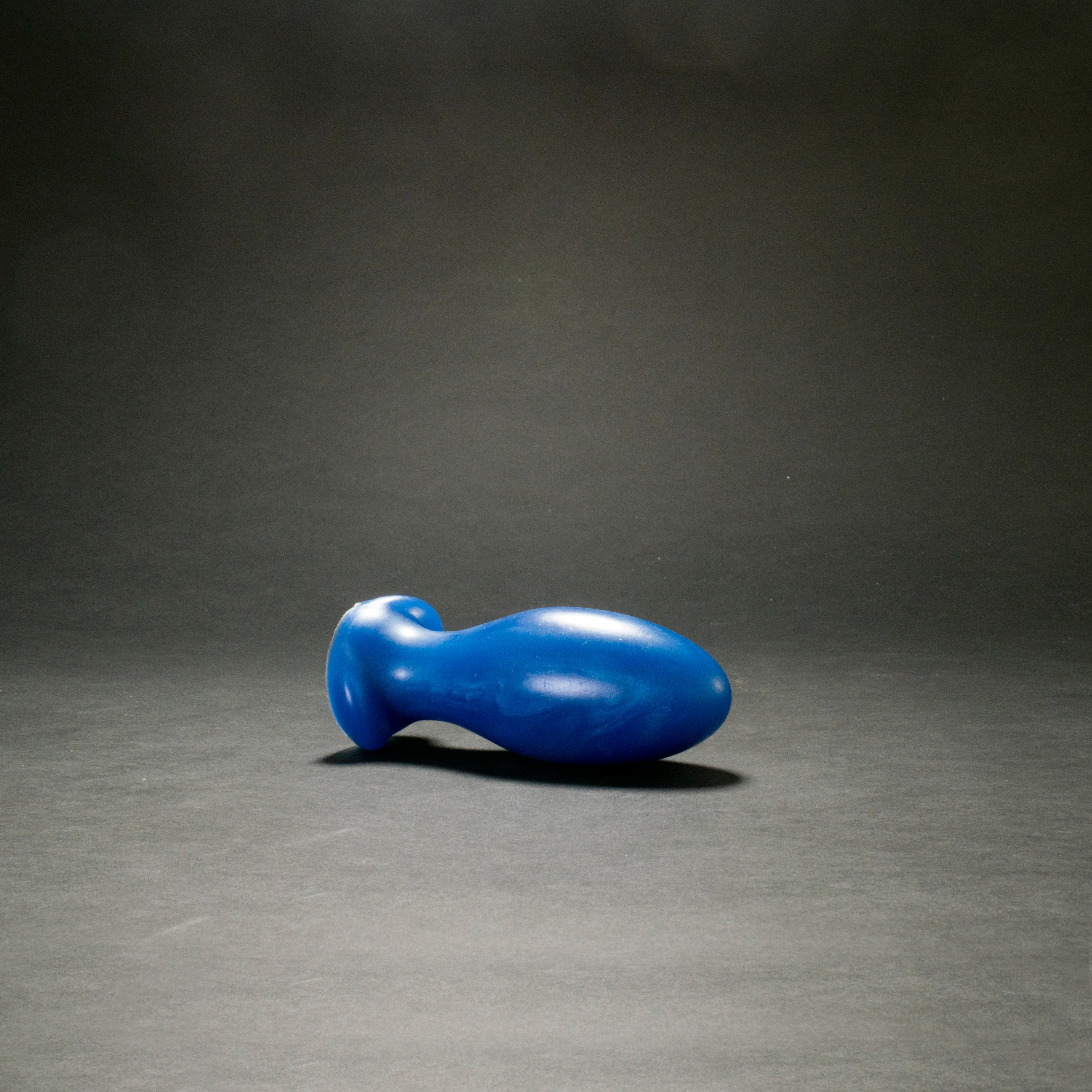 Gape Keeper 65 in Blue Steel laying on its side