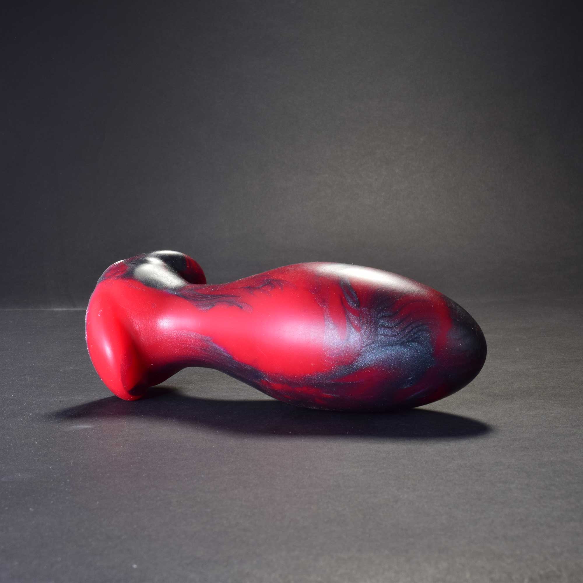 Gape Keeper 75 in Forge Red laying on its side
