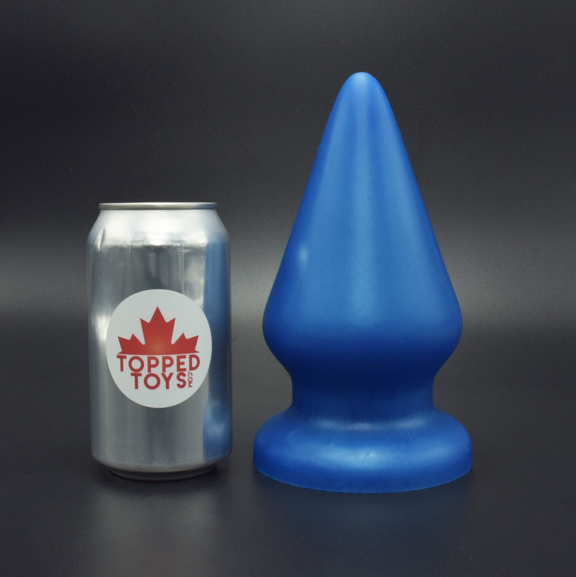 Grip 116 in Blue Steel, next to pop can with Topped Toys logo