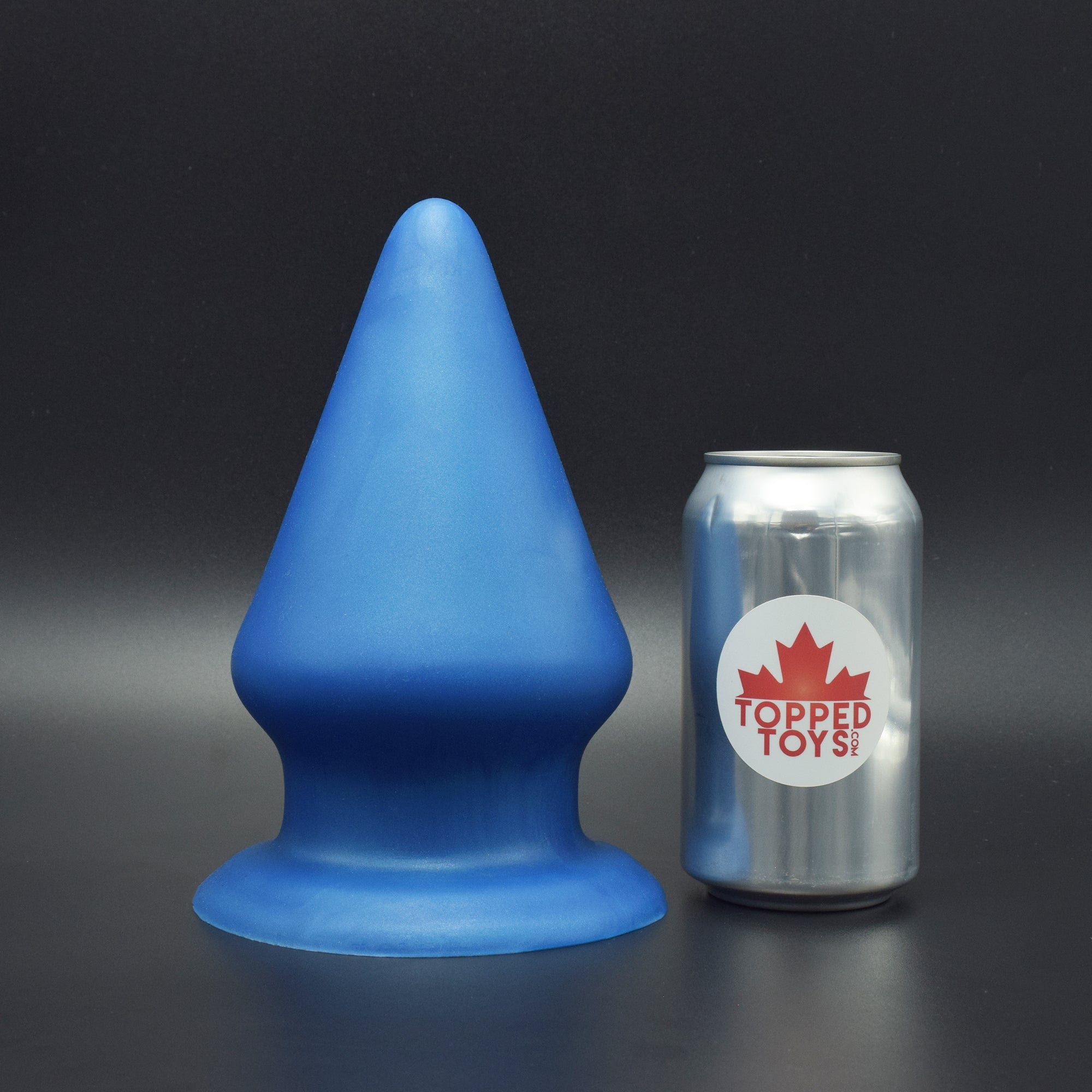 Grip 134 in Blue Steel, next to pop can with Topped Toys logo