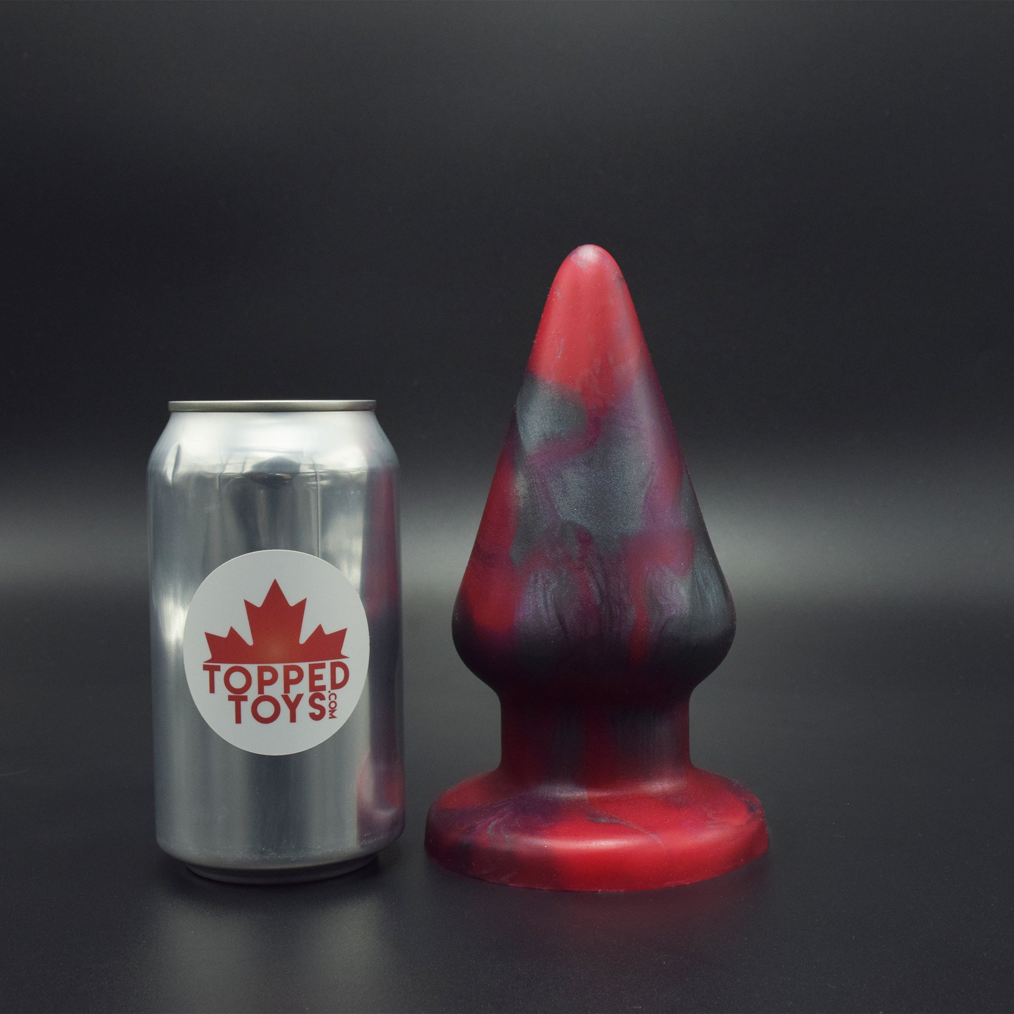 Grip 96 in Forge Red, next to pop can with Topped Toys logo