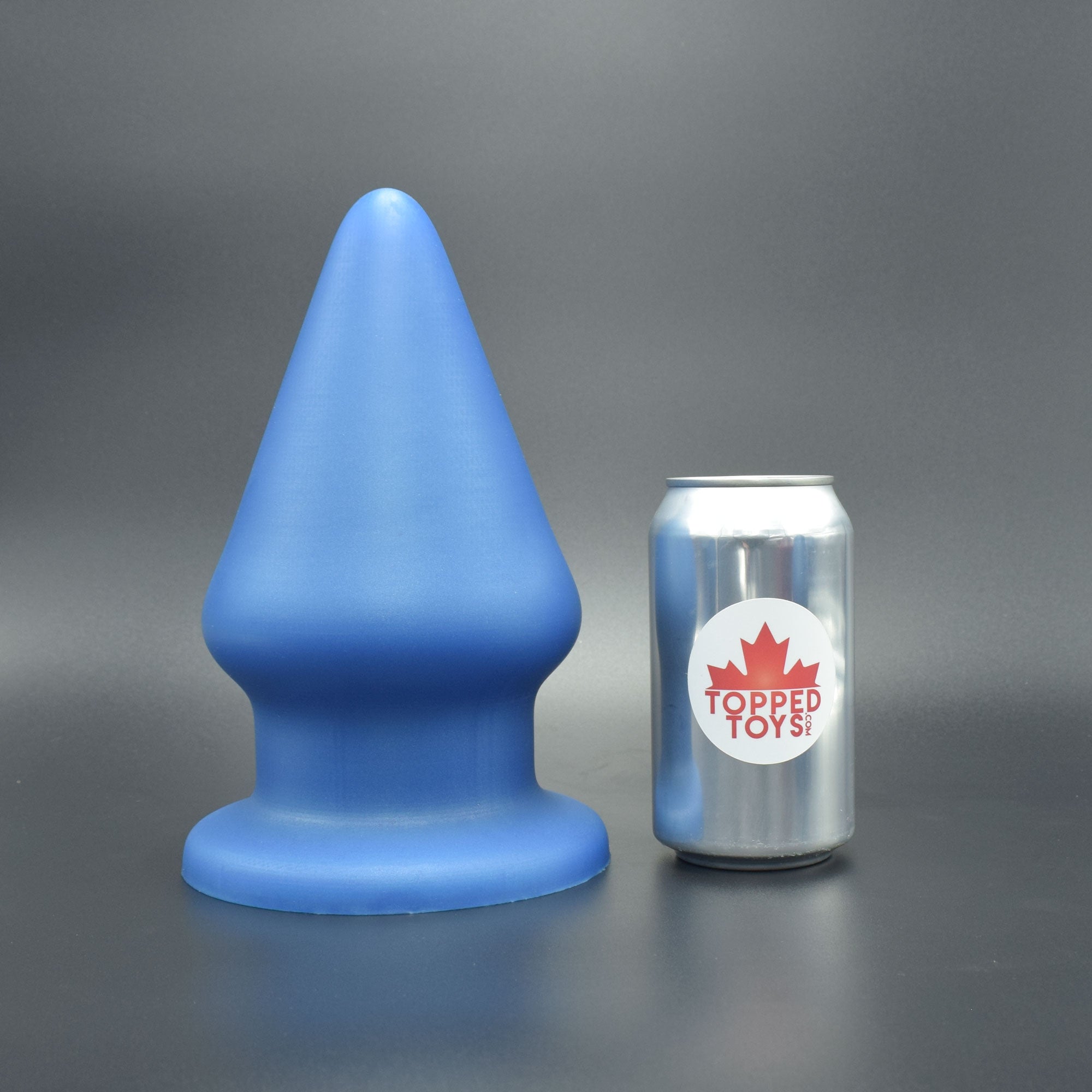 Grip 150 in Blue Steel, next to pop can with Topped Toys logo