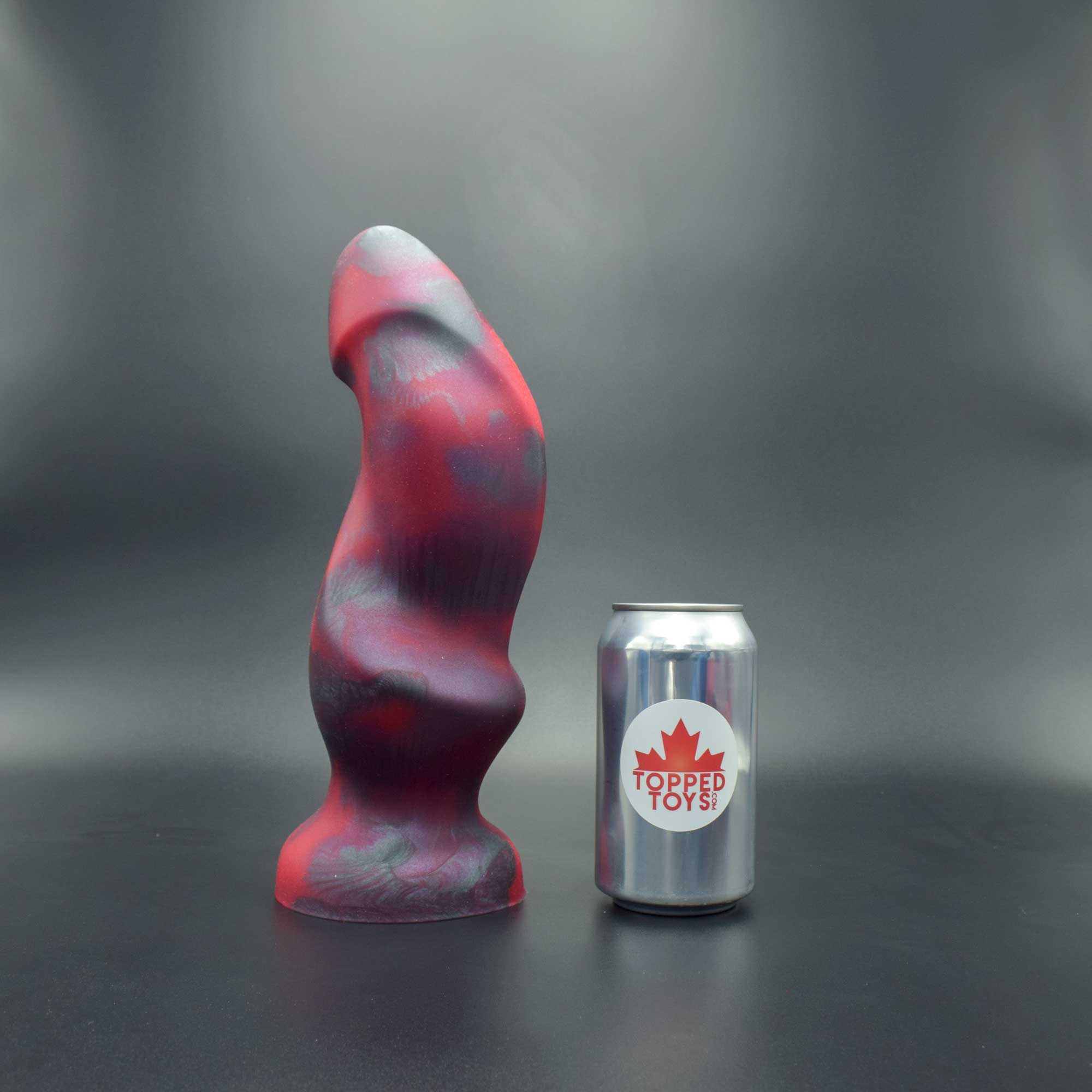 Hilt 115 in Forge Red facing right to show detail, next to pop can with Topped Toys logo