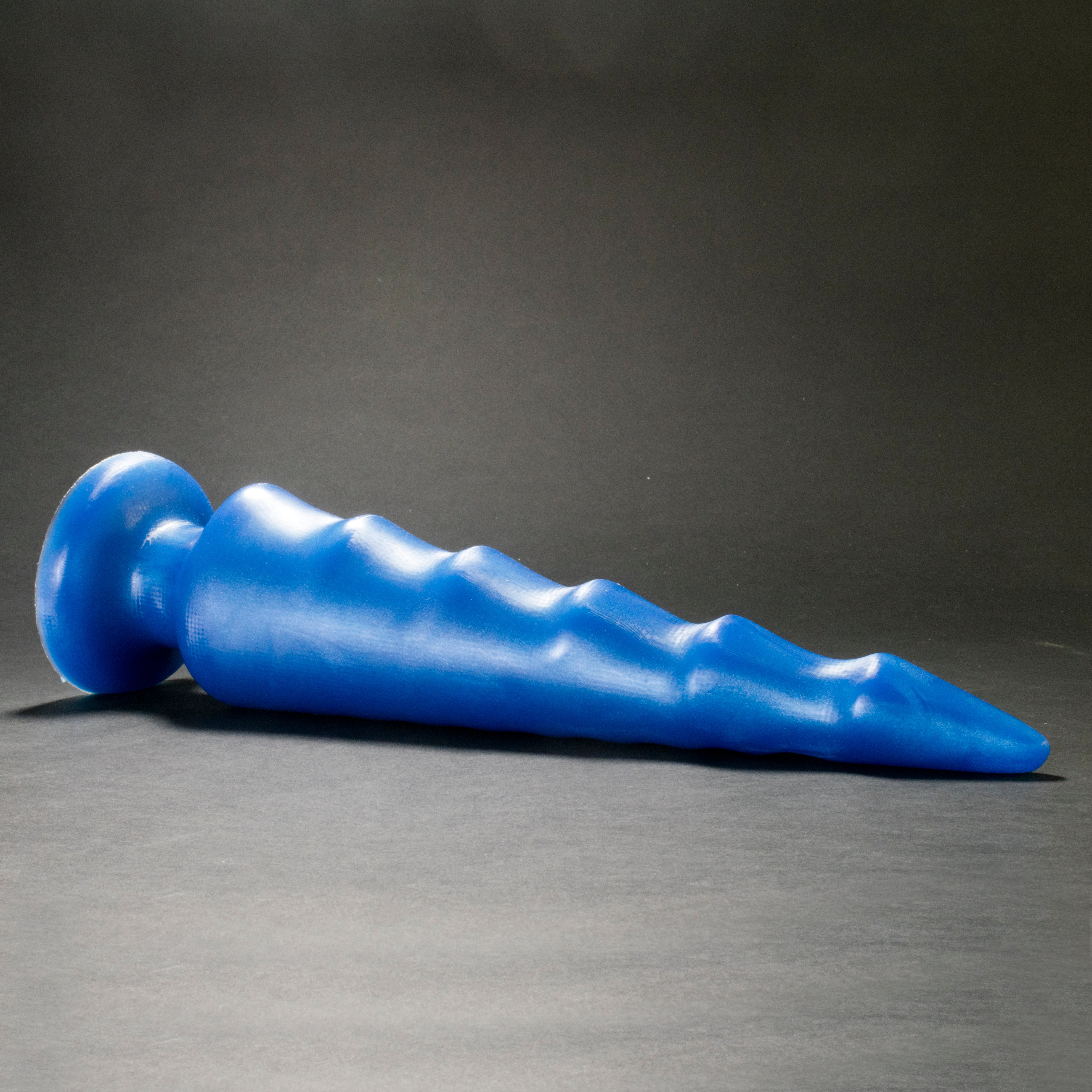 Spike 105 in Blue Steel laying on its side