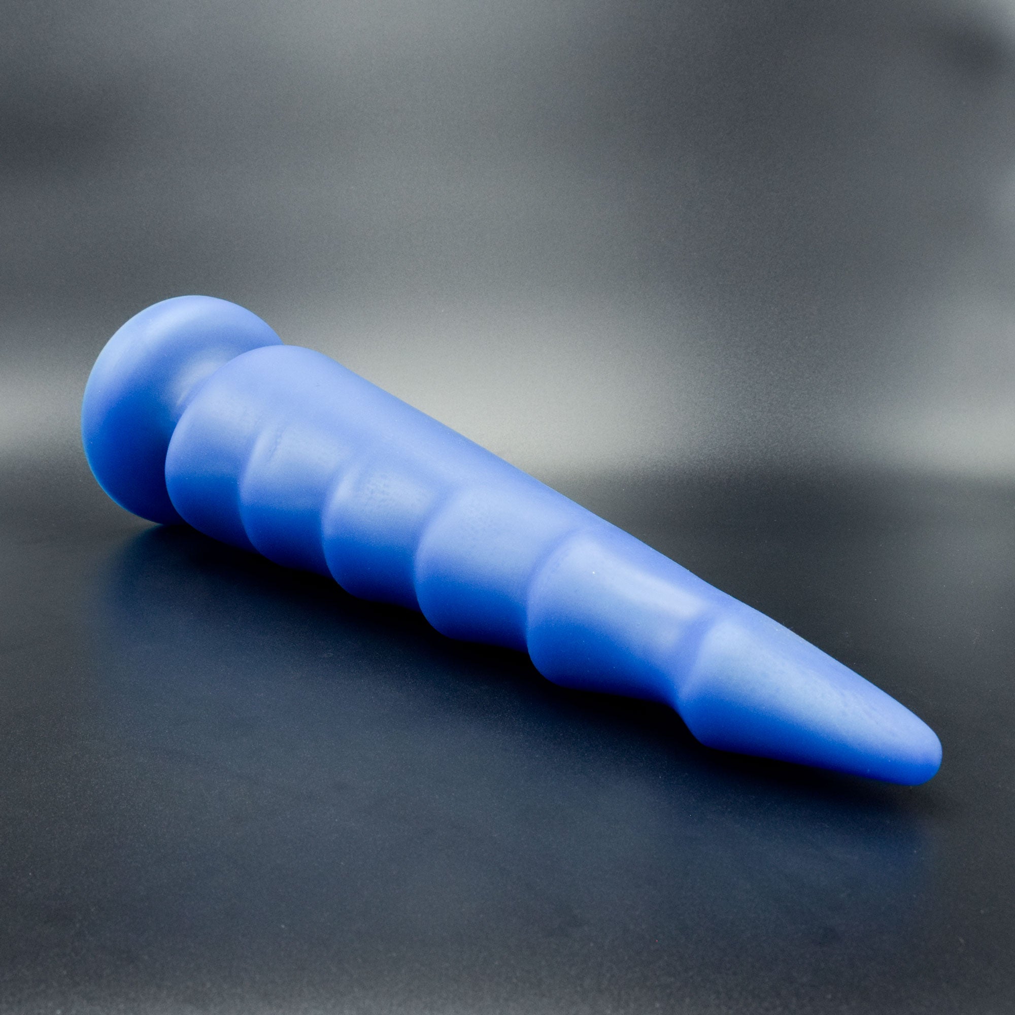 Spike 125 in Blue Steel laying on its side