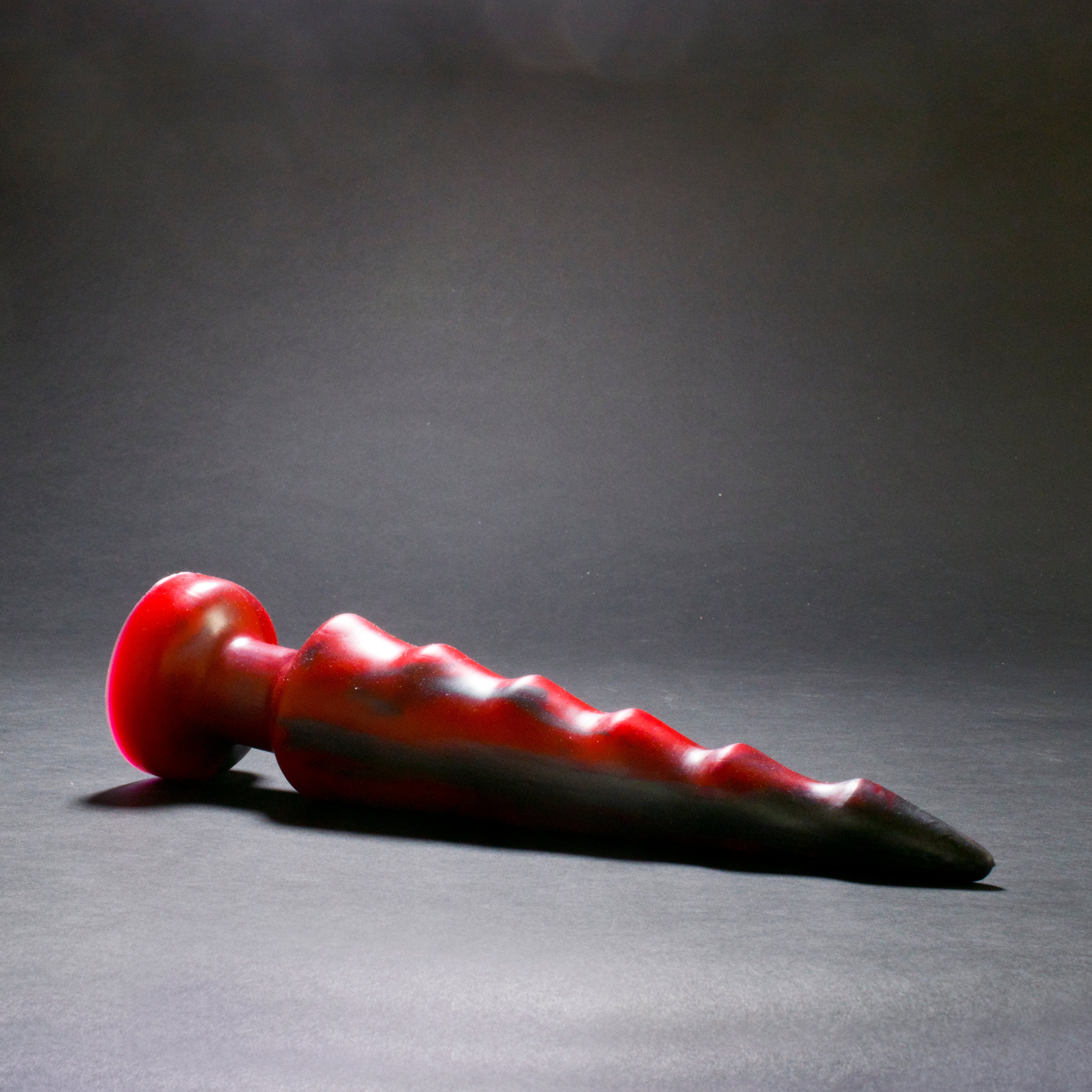 Spike 70 in Forge Red laying on its side