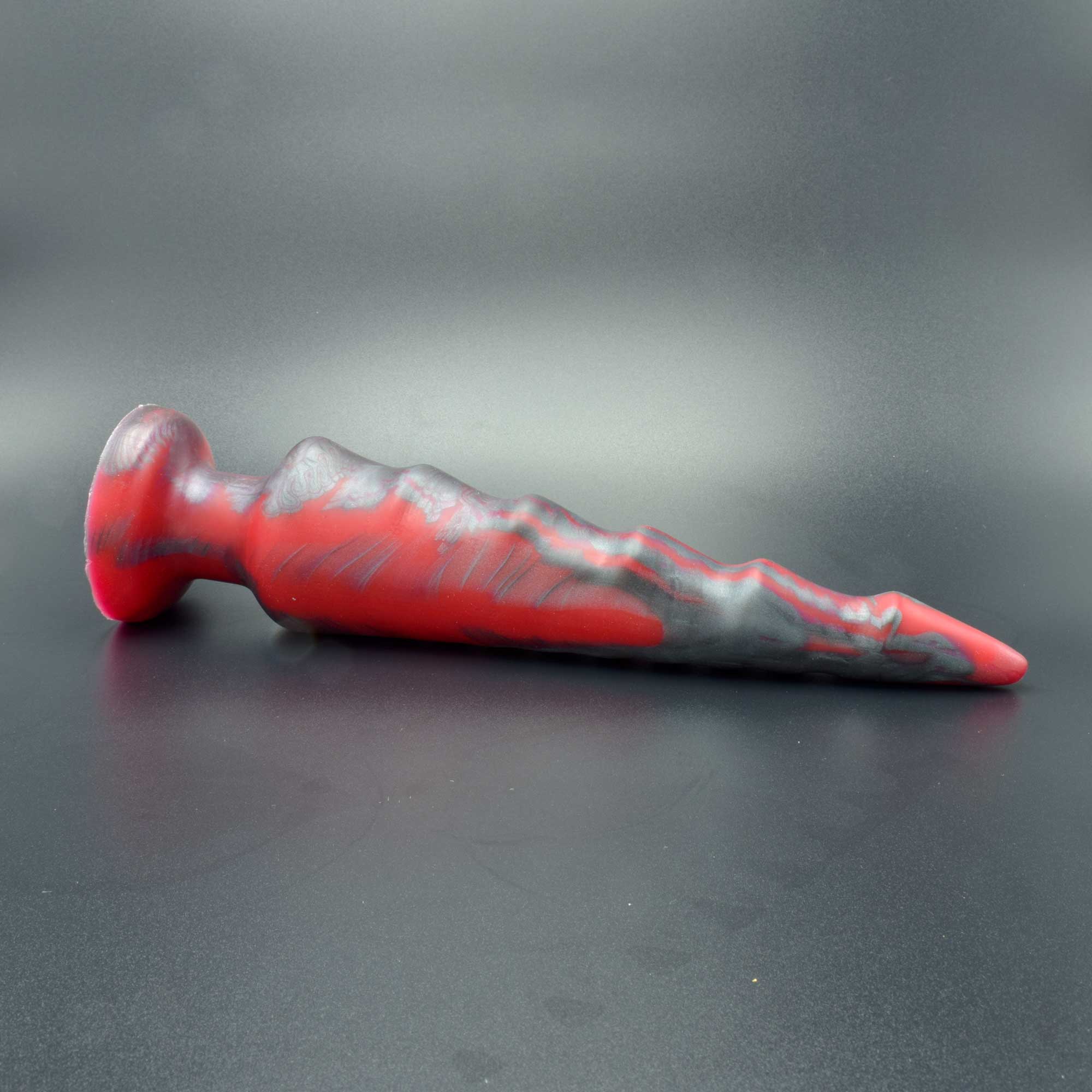 Spike 90 in Forge Red laying on its side