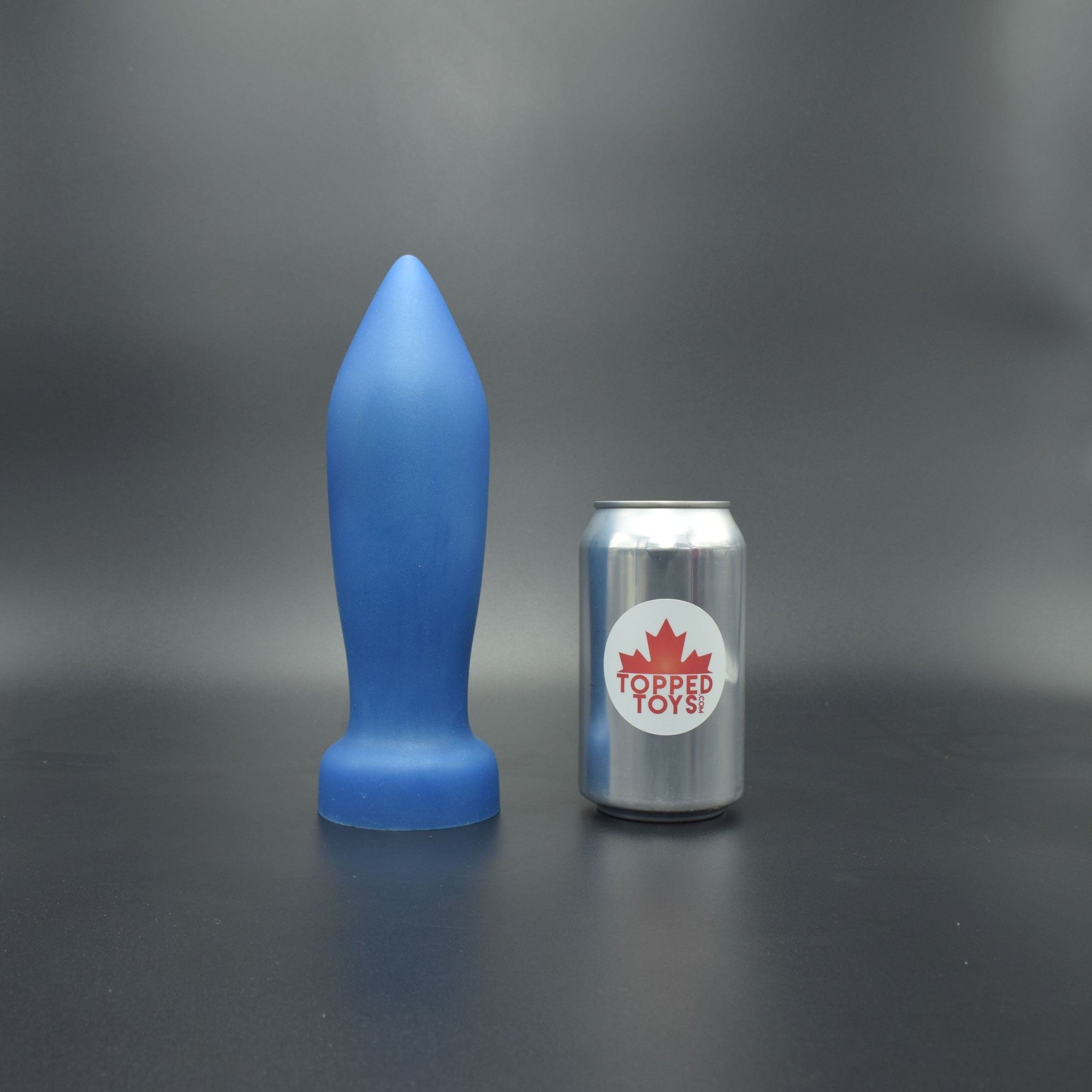 Deep Space 80 in Blue Steel, next to pop can with Topped Toys logo