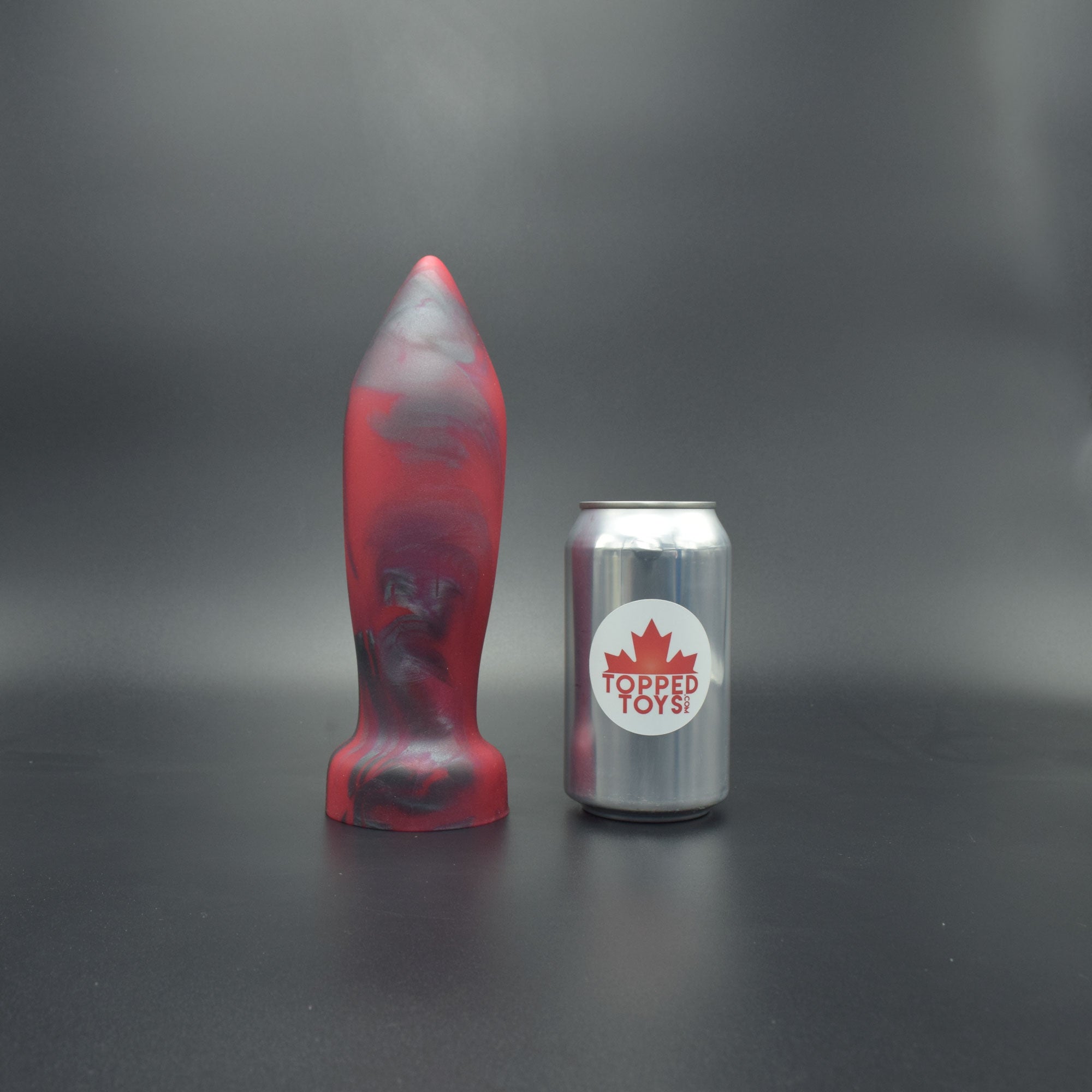Deep Space 80 in Forge Red, next to pop can with Topped Toys logo