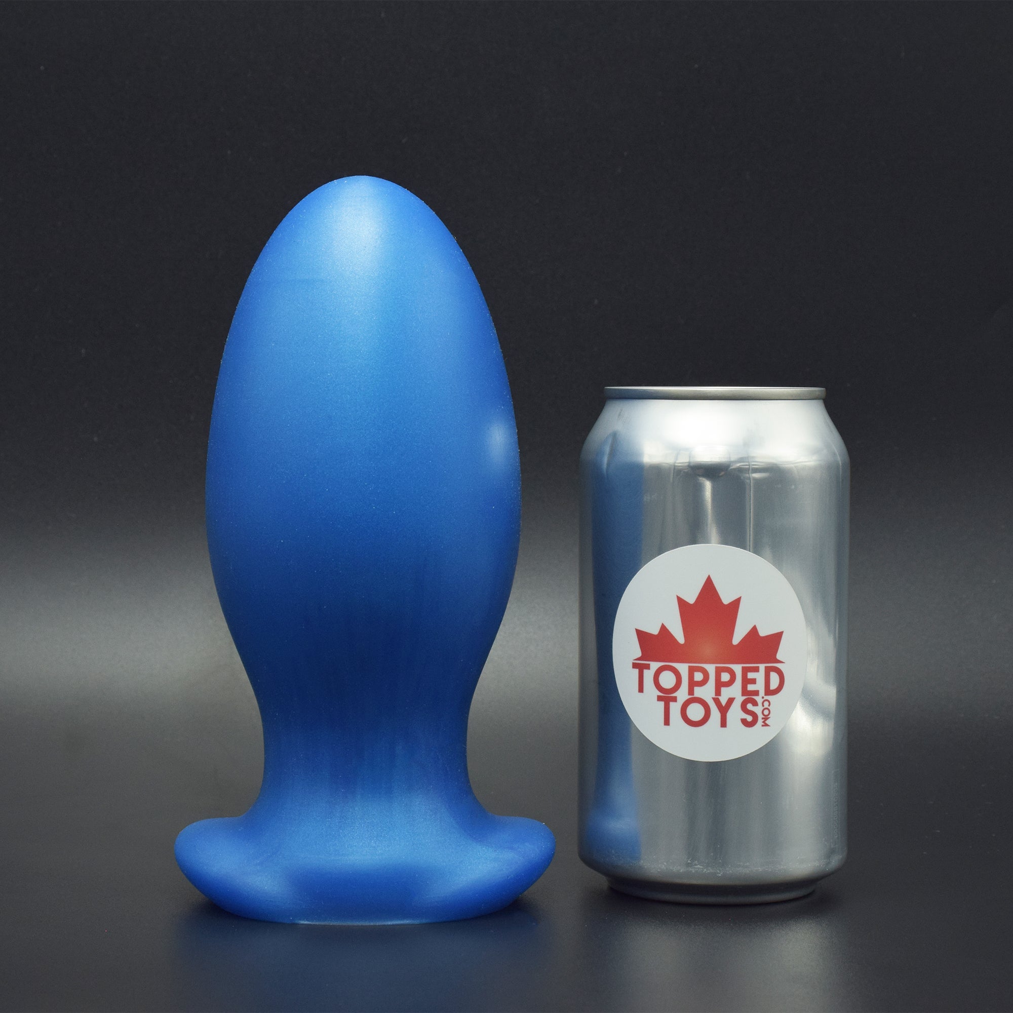 Gape Keeper 93 in Blue Steel, next to pop can with Topped Toys logo