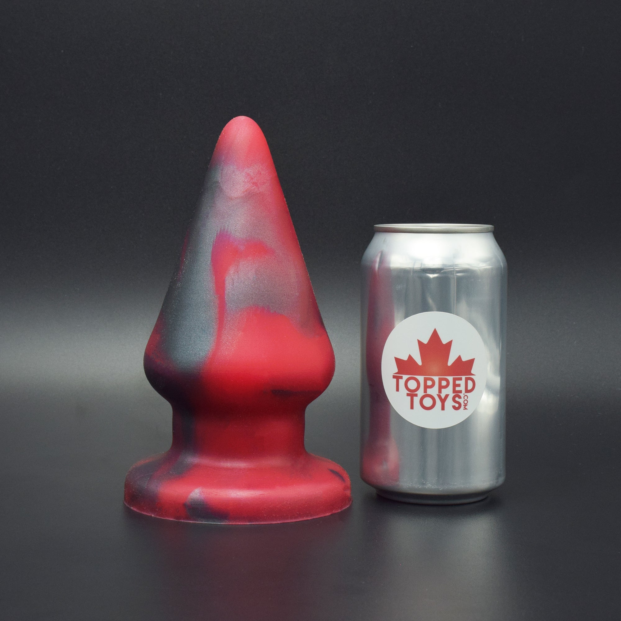 Grip 106 in Forge Red, next to pop can with Topped Toys logo