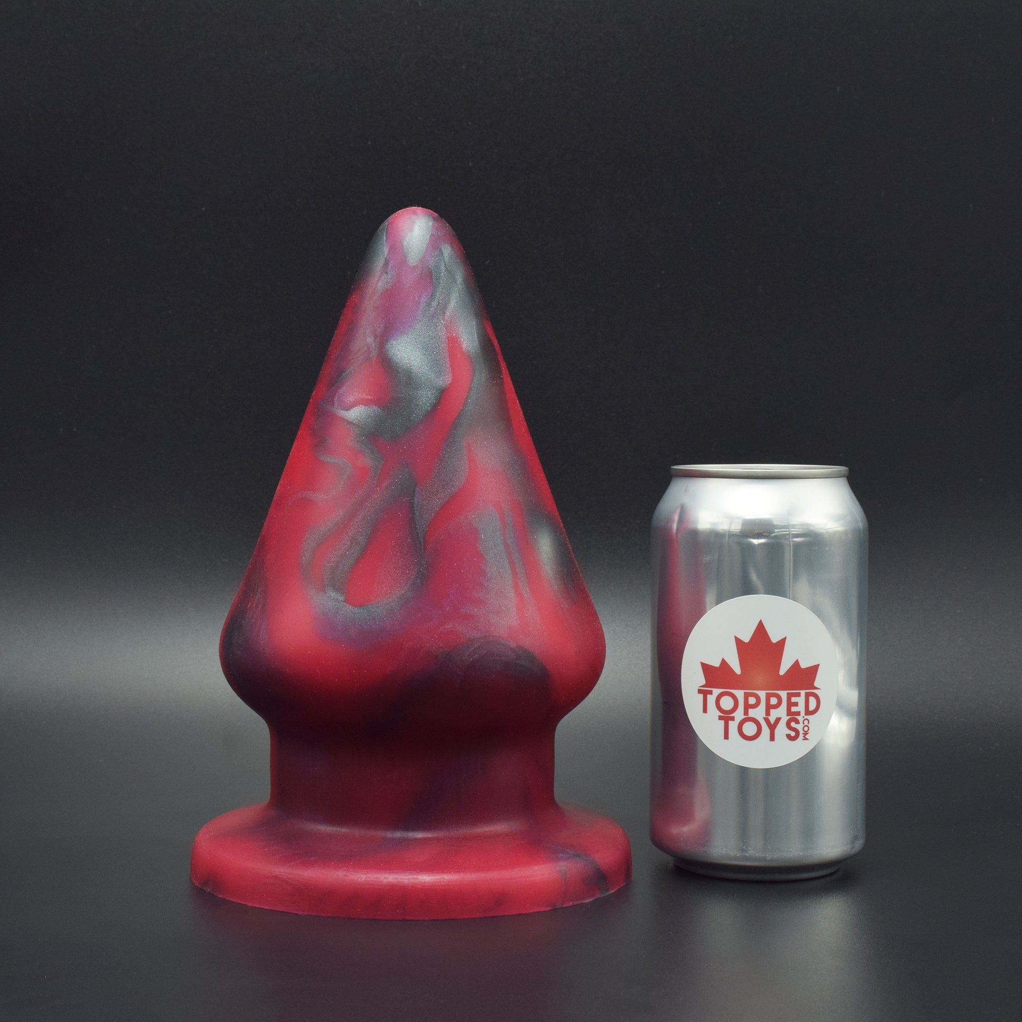 Grip 144 in Forge Red, next to pop can with Topped Toys logo