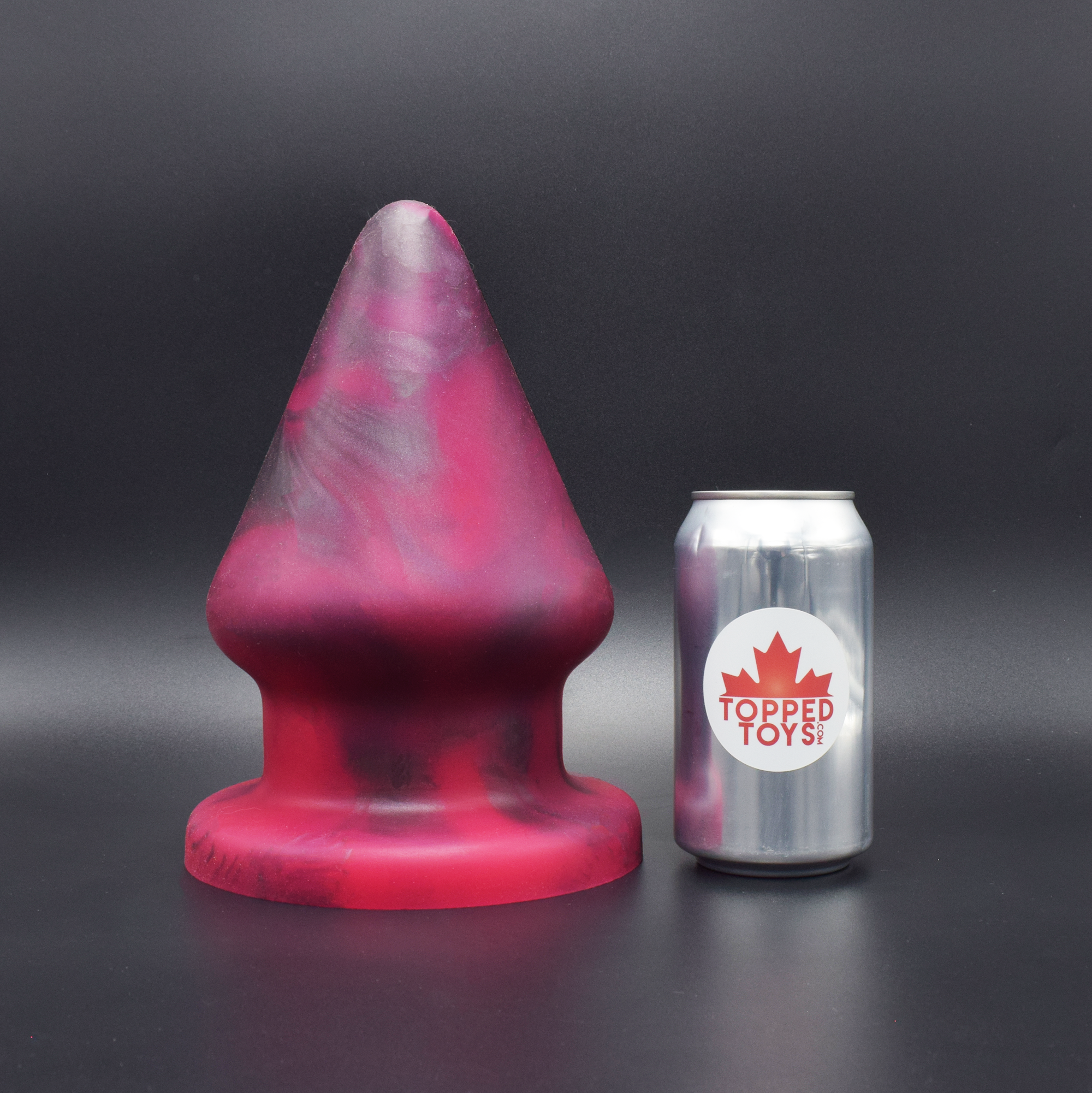 Grip 170 in Forge Red, next to pop can with Topped Toys logo