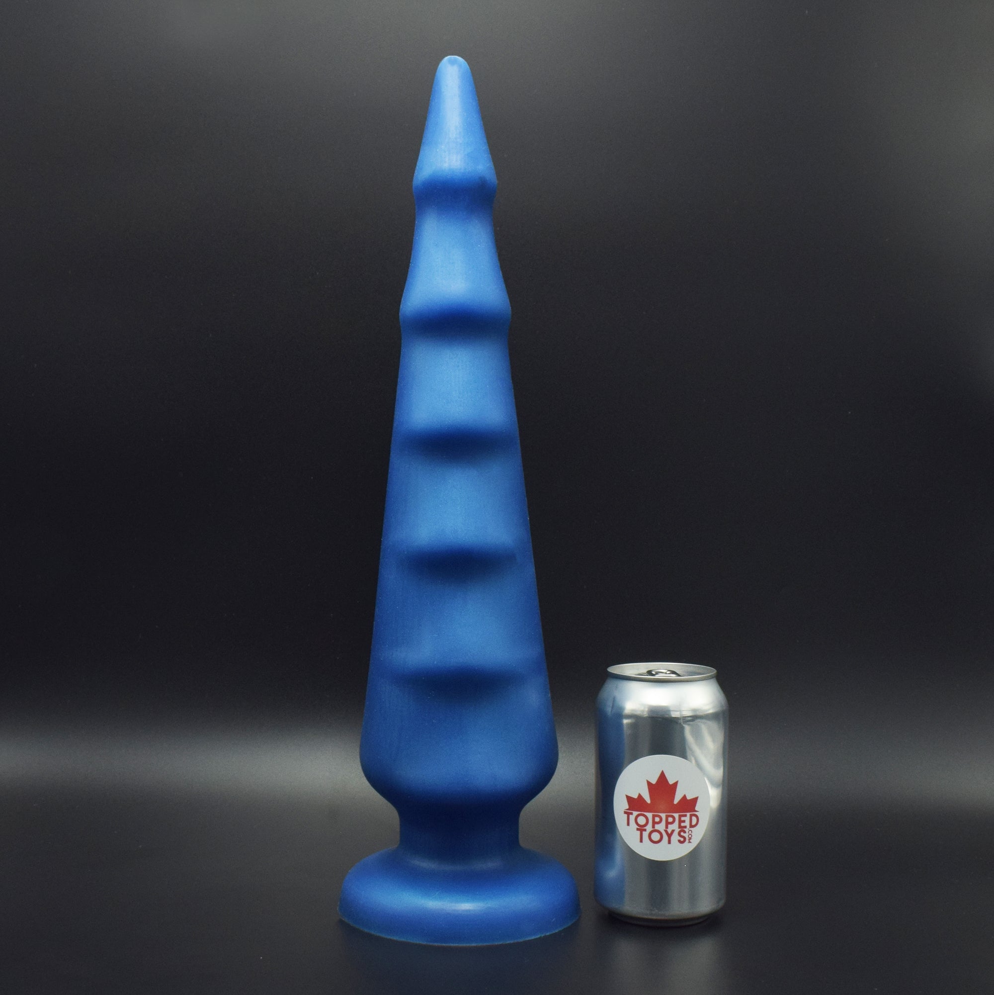Spike 125 in Blue Steel, next to pop can with Topped Toys logo