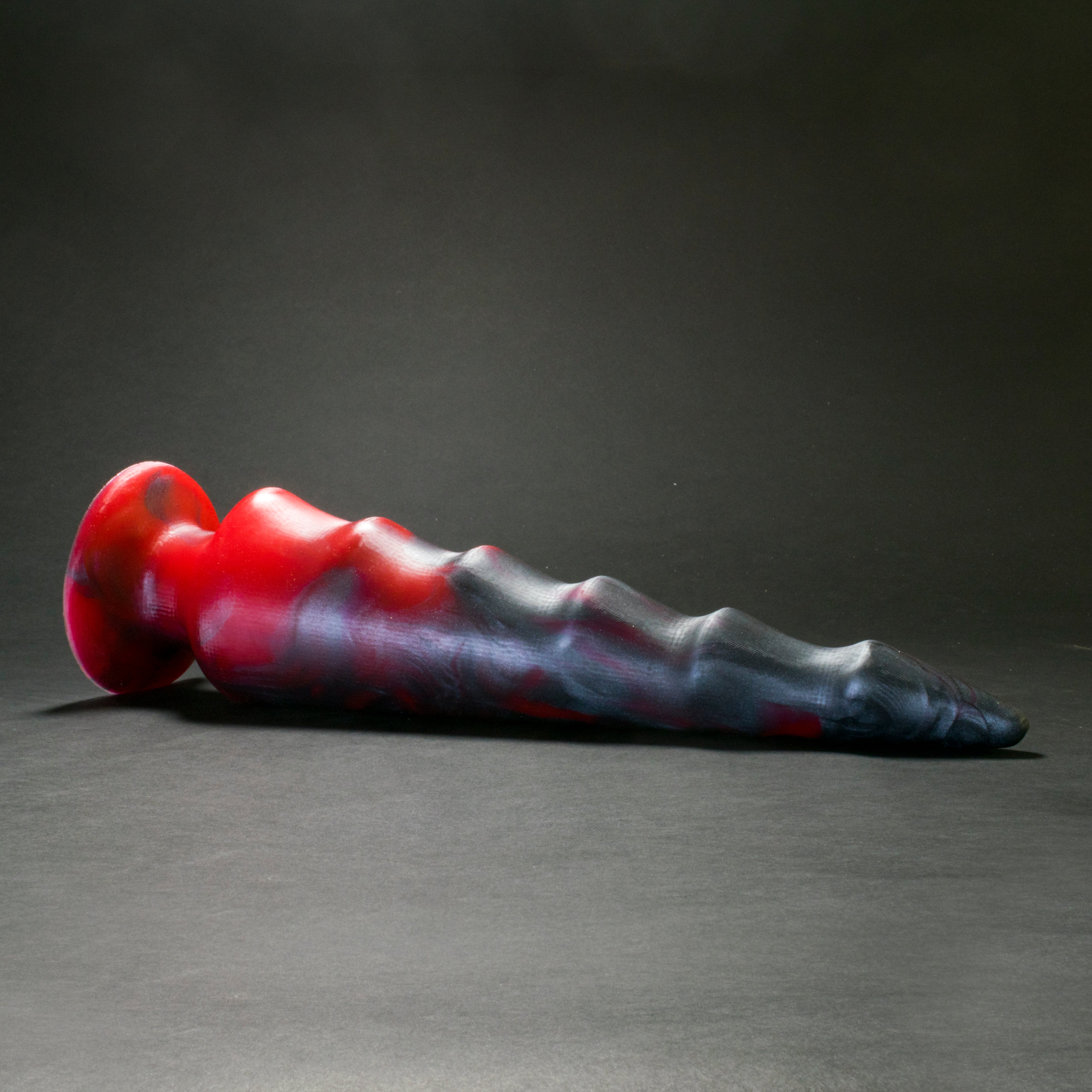 Spike 105 in Forge Red laying on its side