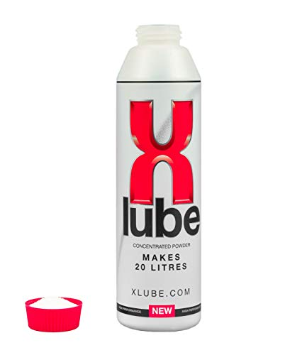 Bottle of X-Lube, next to cap full of X-Lube powder